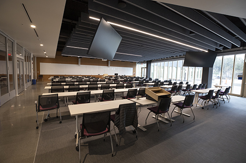 Photo of Lindley 138 - chairs, tables, screens, whiteboards, access to quad outside