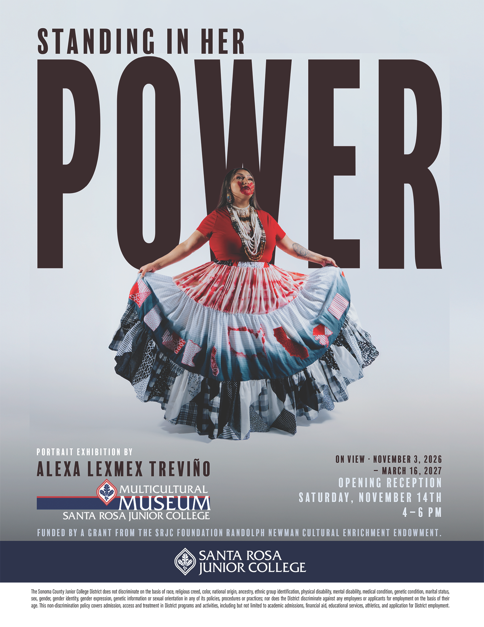 Standing In Her Power: Portraits Beyond the Colonial Frame Flyer featuring a dynamic photo of a Native American woman wearing many necklaces and with a red hand print across her face, holding her skirt with both hands to reveal patchwork in red, black, and blue.  The dates of the exhibit are November 2nd, 2026-March 16th, 2027 and the Reception is Saturday, November 14th from 4:00 - 6:00 pm. 